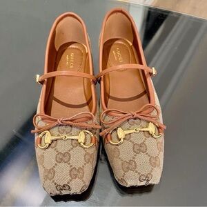 Gucci Women's Brown Loafers with Gold Accents